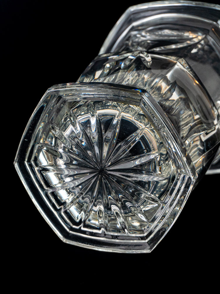 French cut crystal champagne bucket base with geometric starburst pattern on black background.