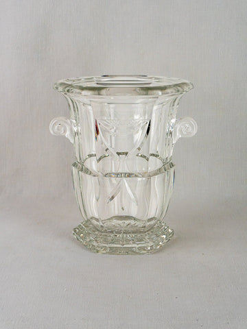 French cut crystal champagne bucket with curled handles, etched patterns, hexagonal base, light gray background.