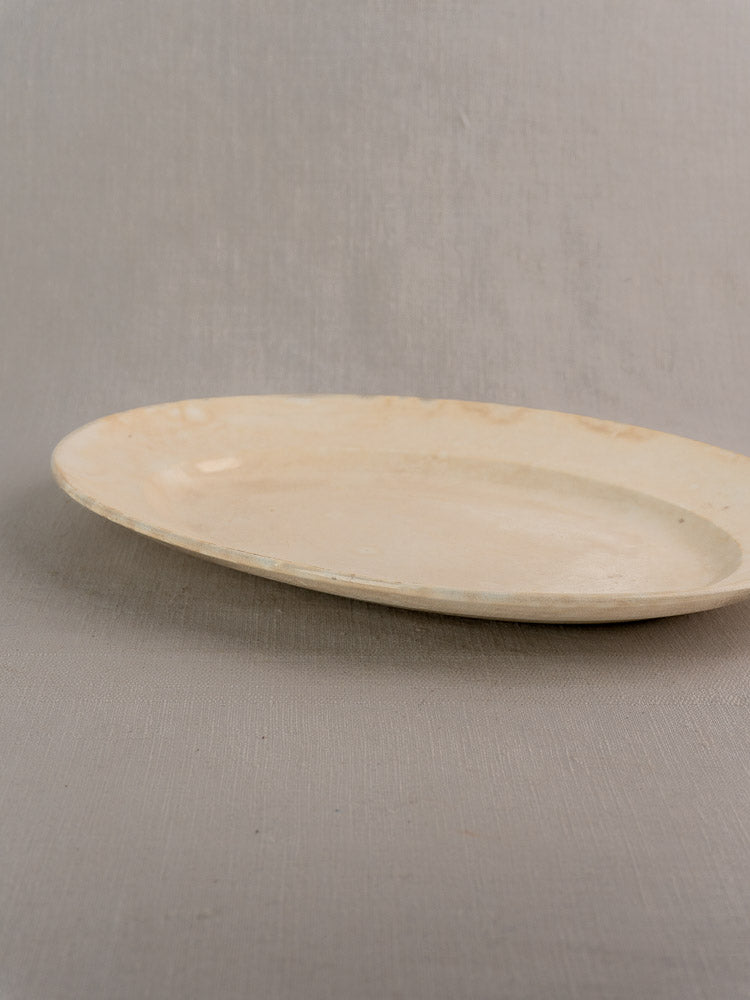 Vintage French Sarreguemines ivory ironstone platter by Digoin & Sarreguemines on neutral fabric.
