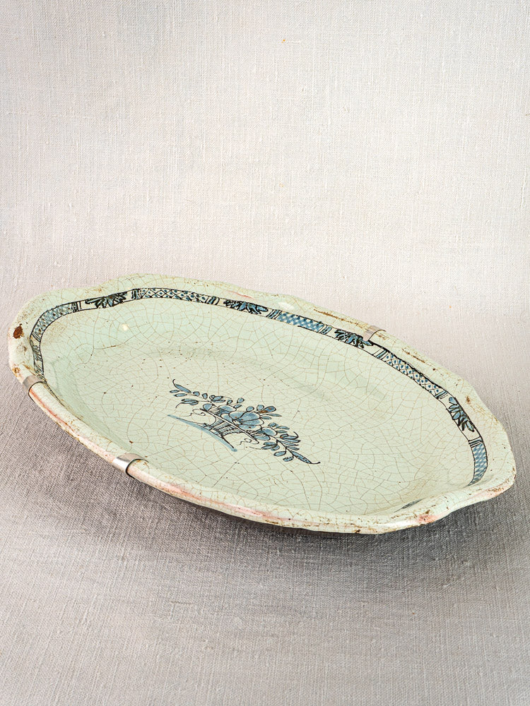 Antique French faience platter, Rouen style, oval tin-glazed earthenware with blue floral design and crackled glaze.