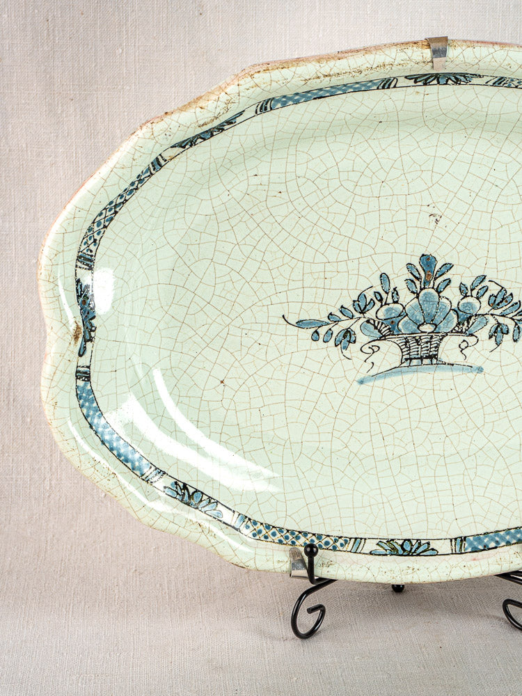 Antique French faience platter, Rouen style, blue floral design, vintage cracked ceramic on stand.