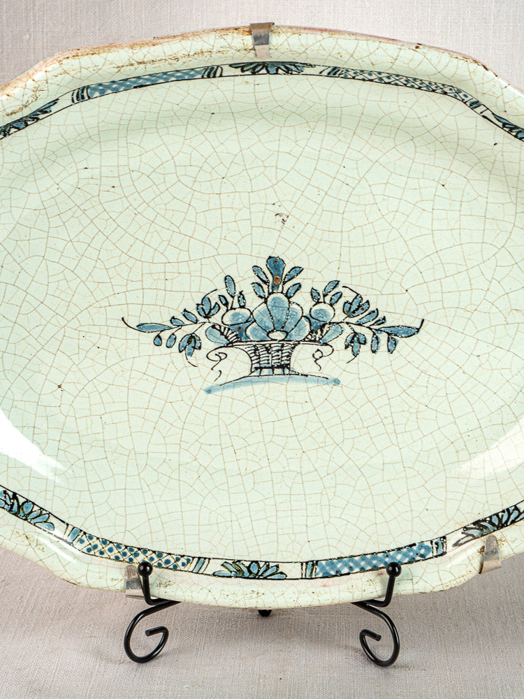Pair of antique French faience oval platters, Rouen style, blue floral basket motifs, crackled glaze.