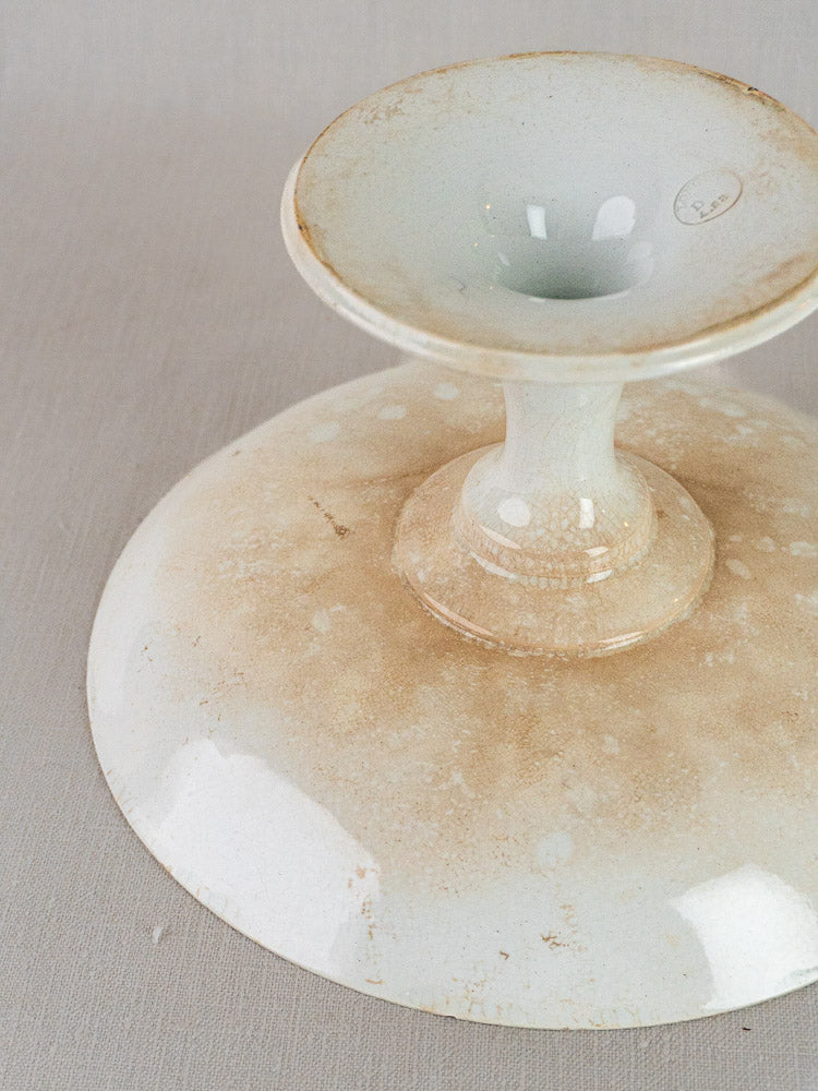 Longwy White Craquelé antique French faience pedestal dish with off-white, light brown, speckled weathered finish.