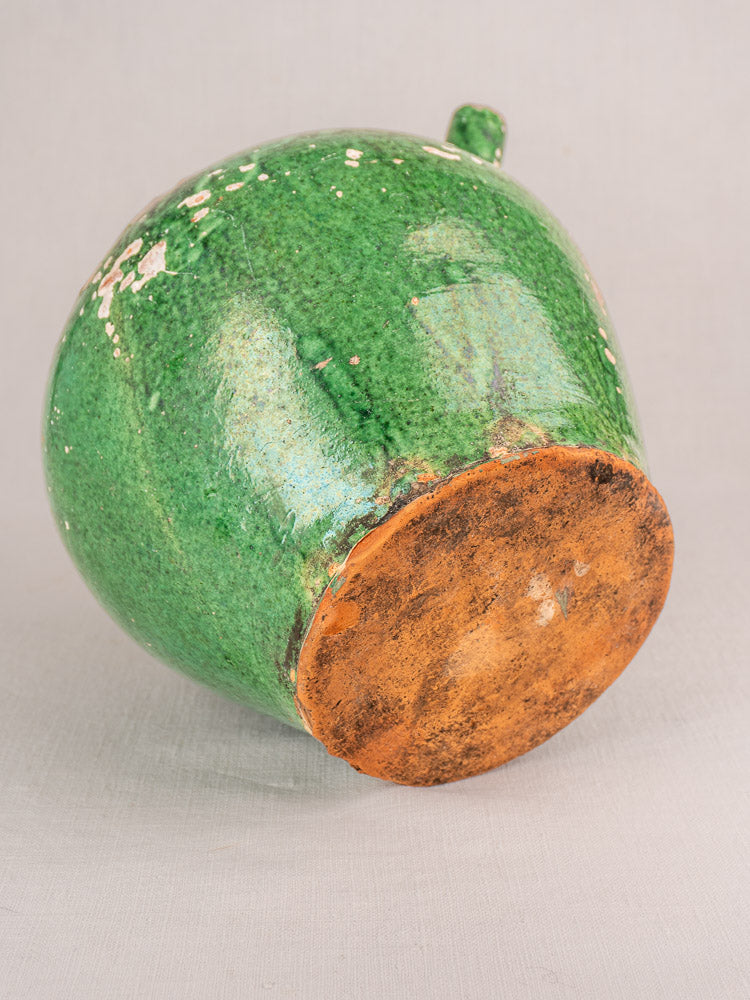 Antique French green-glazed gargoulette, late 19th–early 20th century, chipped glaze, orange-brown base.