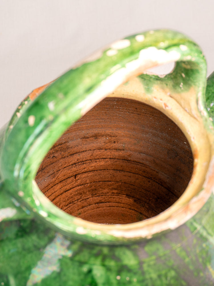 Antique French gargoulette with Provençal green glaze, large handle, open mouth, exposed earthenware interior. Late 19th–early 20th century.