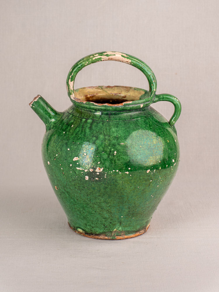 Antique French Provençal green glazed earthenware gargoulette jug with rounded body and arched handle, areas of glaze wear.