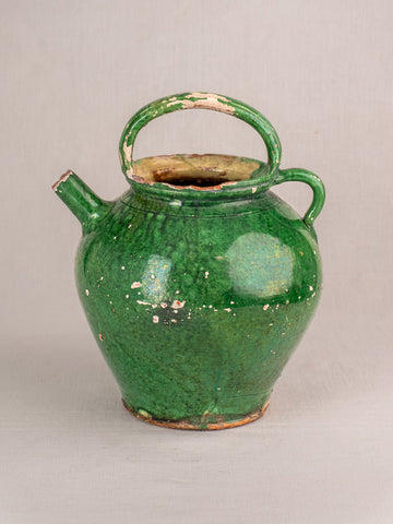 Antique French Provençal green glazed earthenware gargoulette jug with rounded body and arched handle, areas of glaze wear.