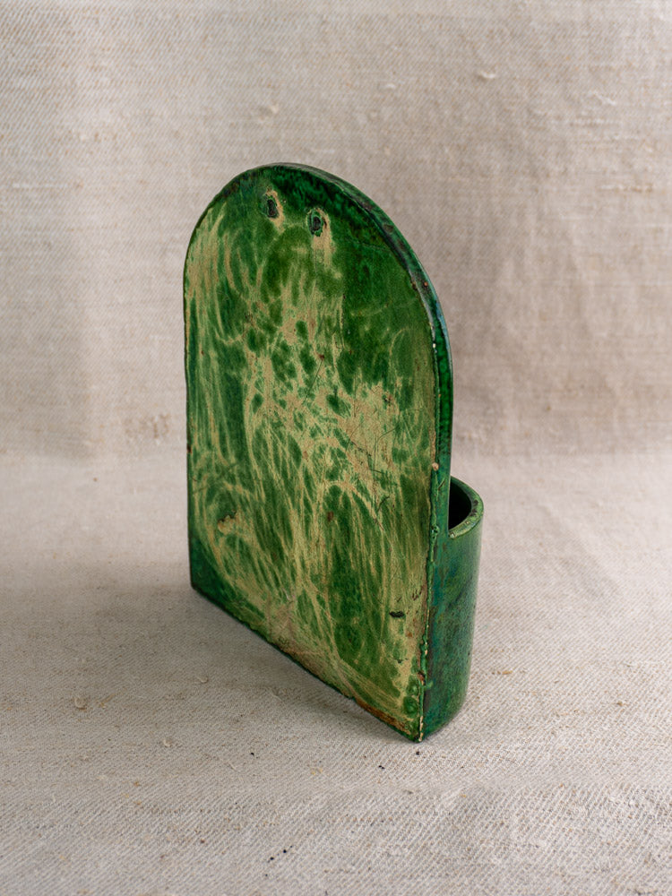 Antique French green glazed earthenware wall utensil holder with textured, aged finish from late 19th-early 20th century.
