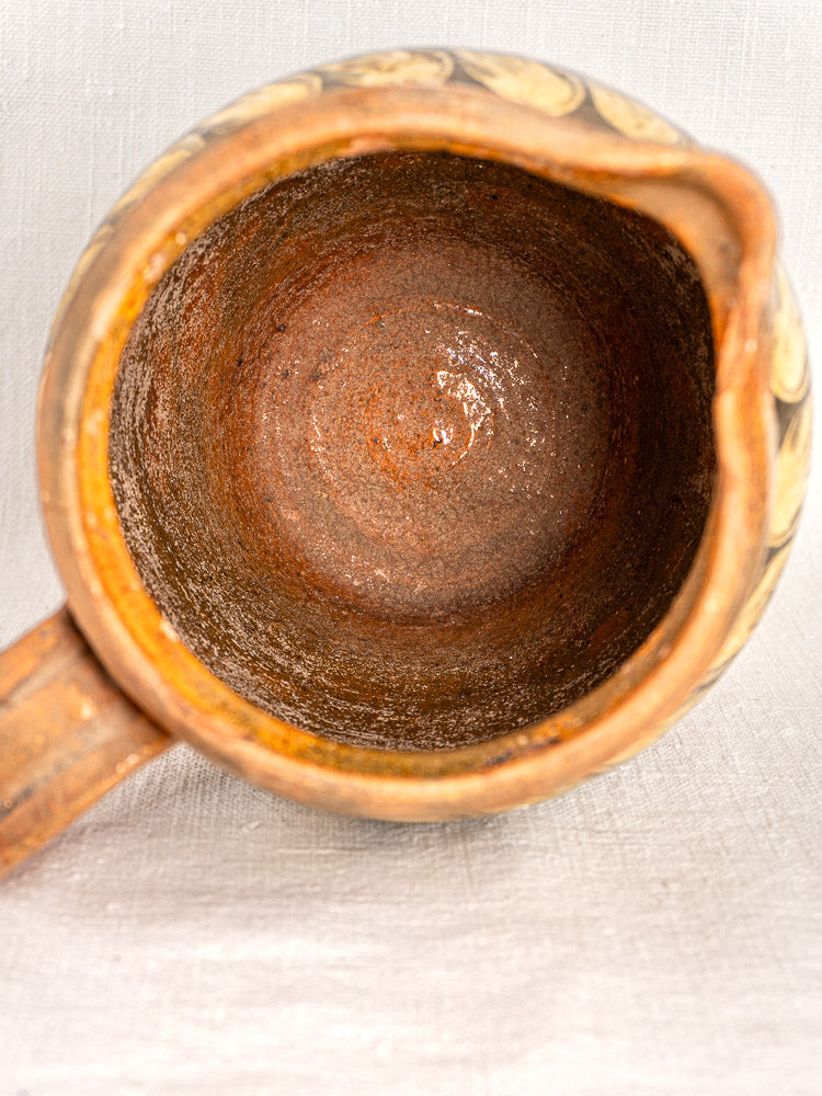 Antique French Pichet Jaspé, late 19th century Savoie slipware pitcher with painted designs on fabric.