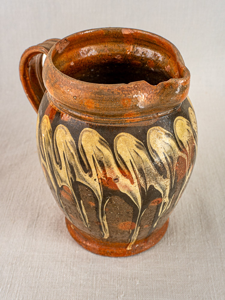 Antique French Savoie slipware pichet jaspé, brown ceramic with cream glaze, chipped rim.