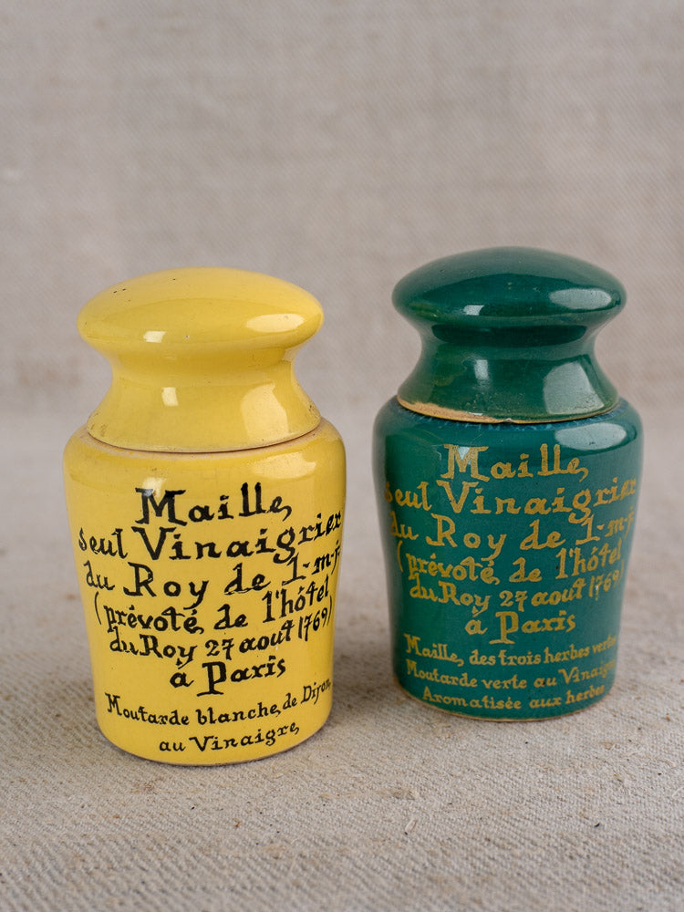 Pair of vintage French Maille mustard pots with teal and yellow painted ceramic design.