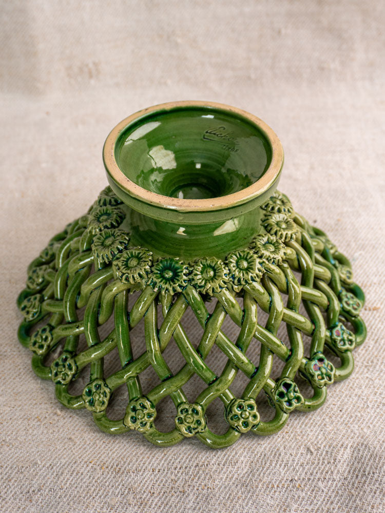 Vintage French Pichon Uzès woven basket with green glaze, lattice design, glossy finish, on textured beige surface.