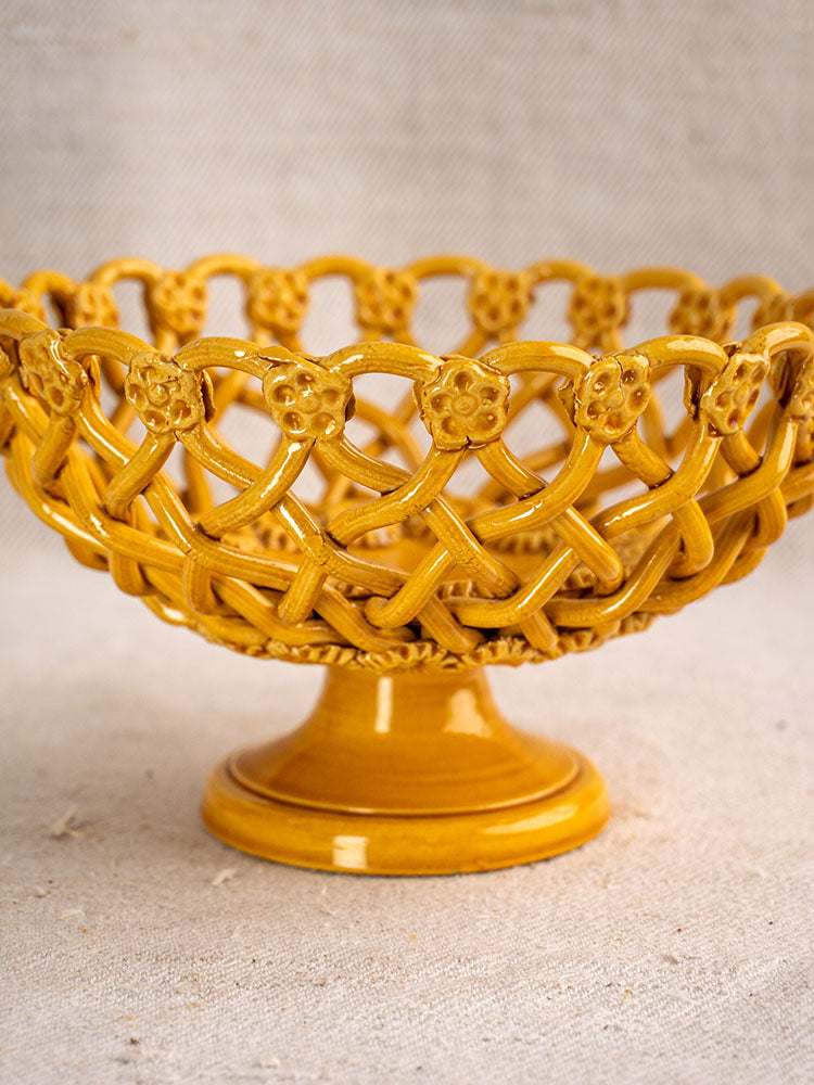 Provence Yellow Pichon Uzès woven ceramic bowl with floral accents on a textured beige surface.
