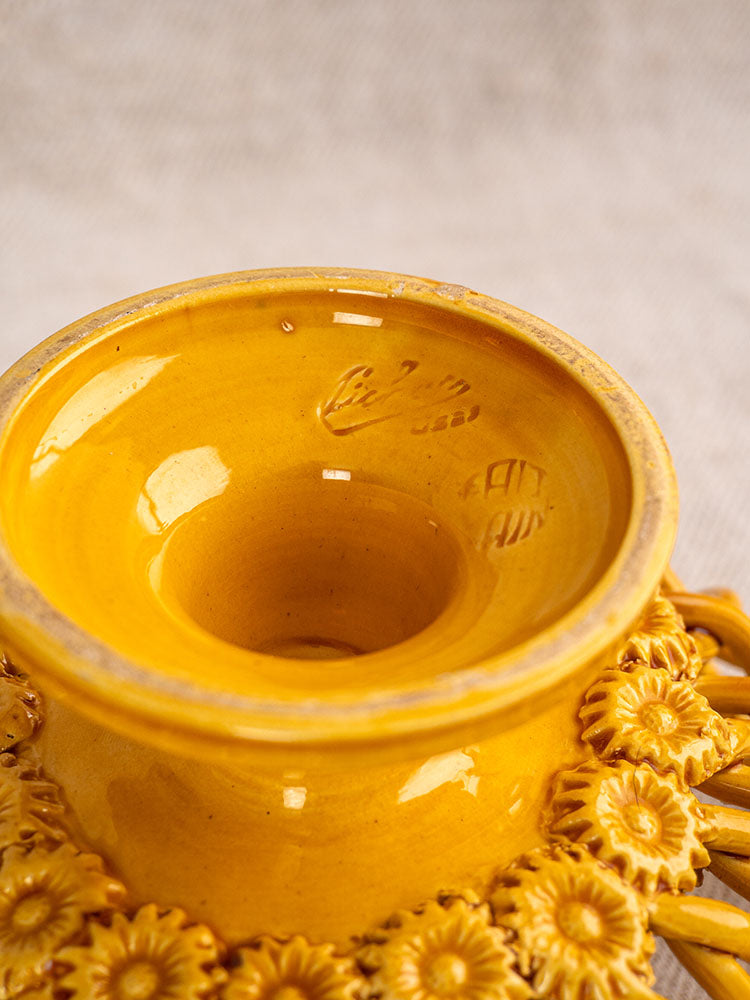 Provence Yellow Pichon Uzès woven ceramic bowl with glossy sunflower motifs, shown on a neutral textured surface.