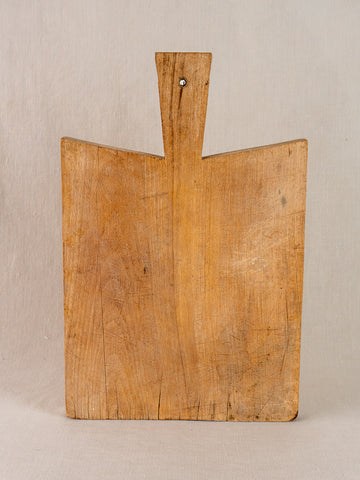 Antique French hardwood cutting board in traditional Provencal style with visible grain and gentle wear.