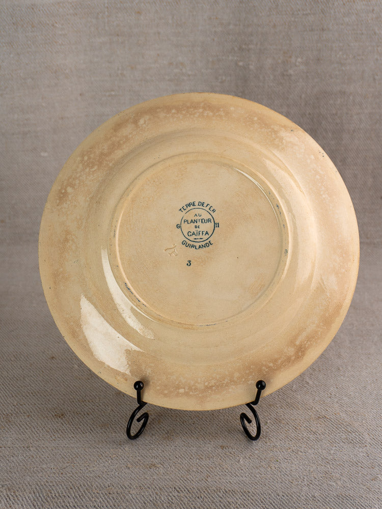 Set of six antique French Terre de Fer faience dinner plates, Caïffa Guirlande pattern, showing stamped beige undersides.