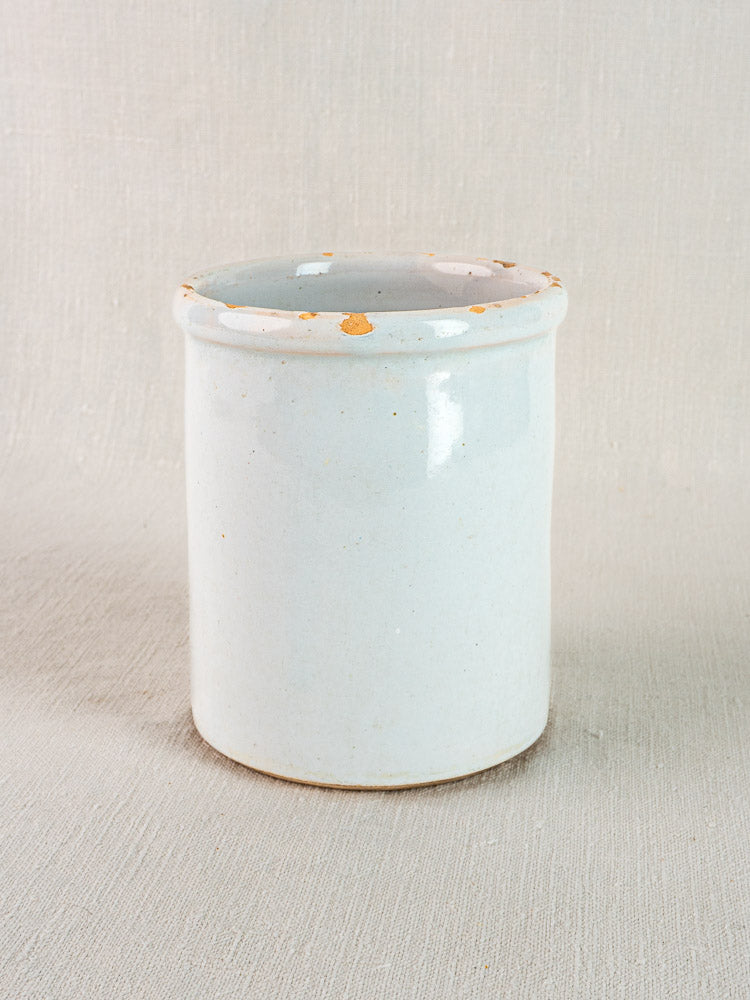 Antique white French Pot à Rillettes in glazed earthenware with flared rim and brown accents.