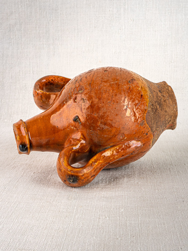 Antique French terracotta wine gourde with rich brown glaze and weathered, artisanal finish.