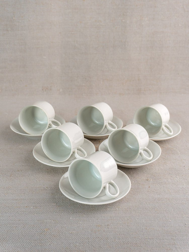 Vintage Hutschenreuther German porcelain demitasse set of six white espresso cups on saucers.
