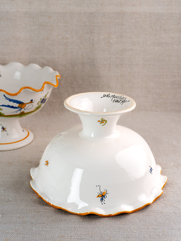 Pair of vintage French Moustiers-style compotes in hand-painted white faience with orange rims on beige fabric.