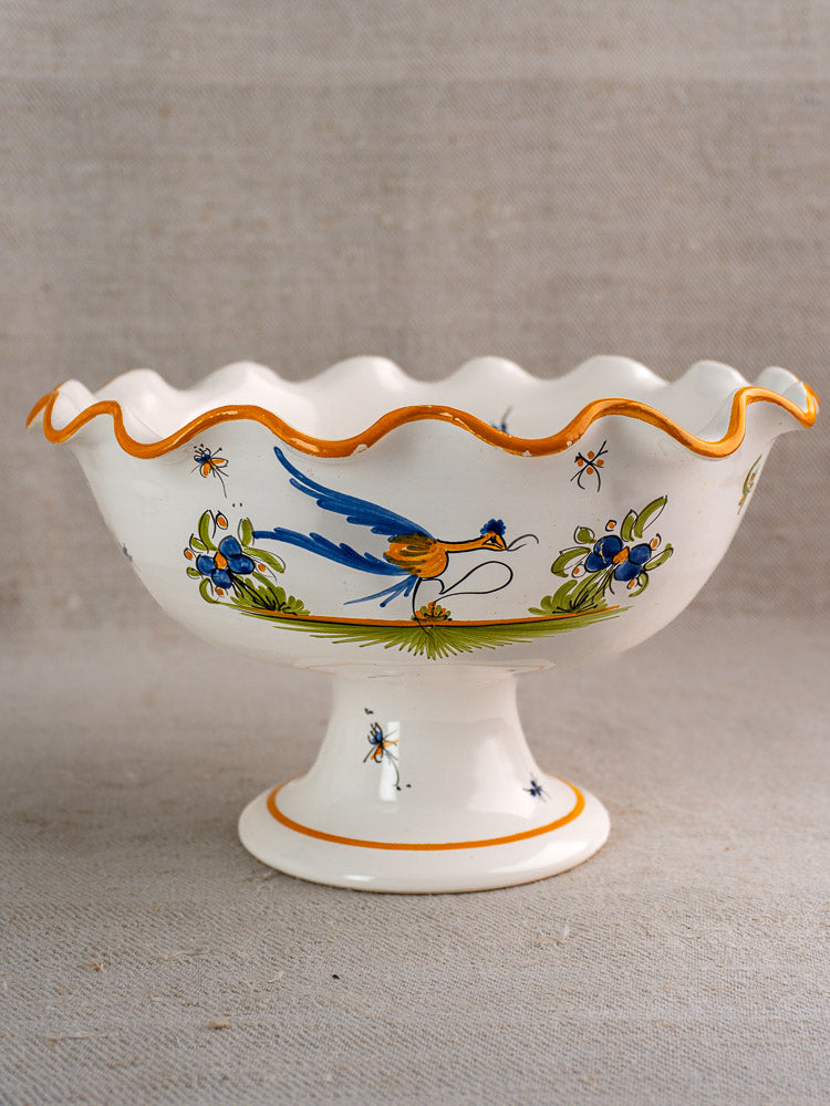 Pair of vintage French Moustiers-style white faience compotes with wavy orange rims and hand-painted birds.