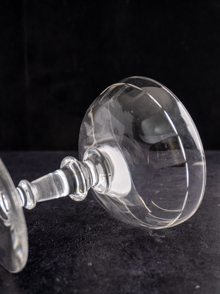 Antique French Champagne coupes, late 19th century, hand blown glass with rounded bowls and slender stems.