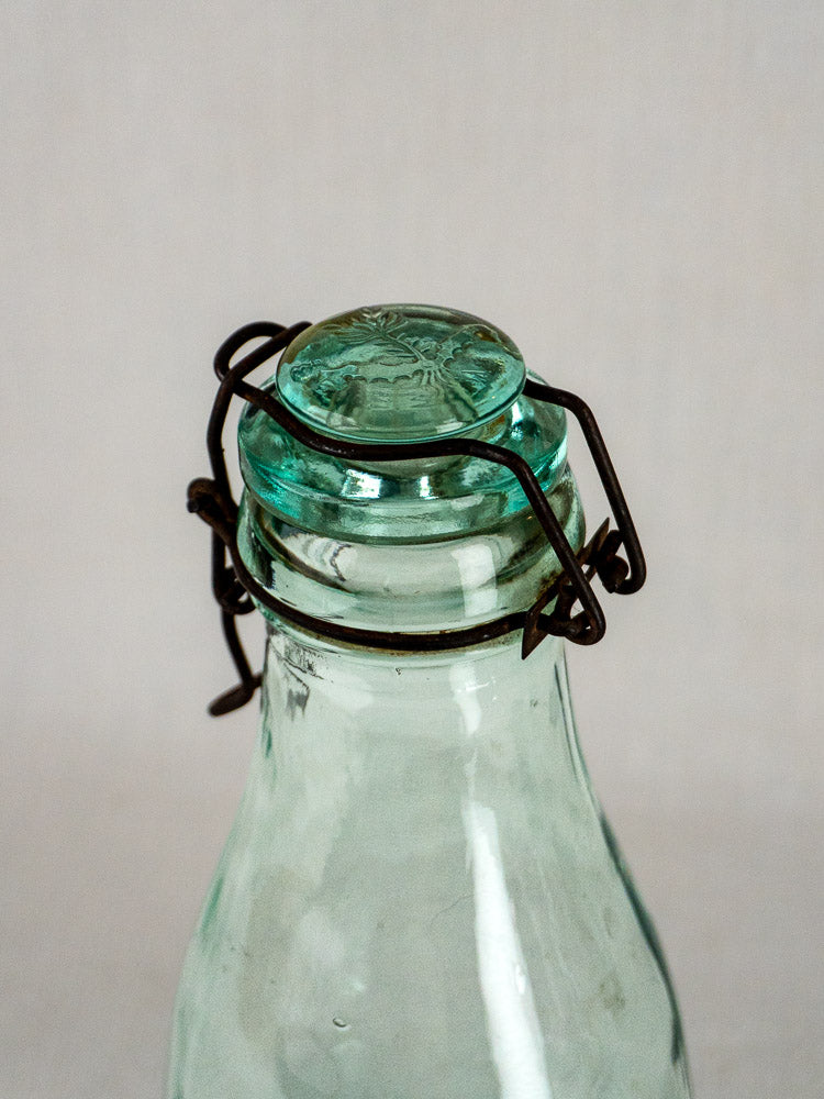 La Lorraine antique French preserving bottle with thick glass stopper and vintage metal wire clasp.