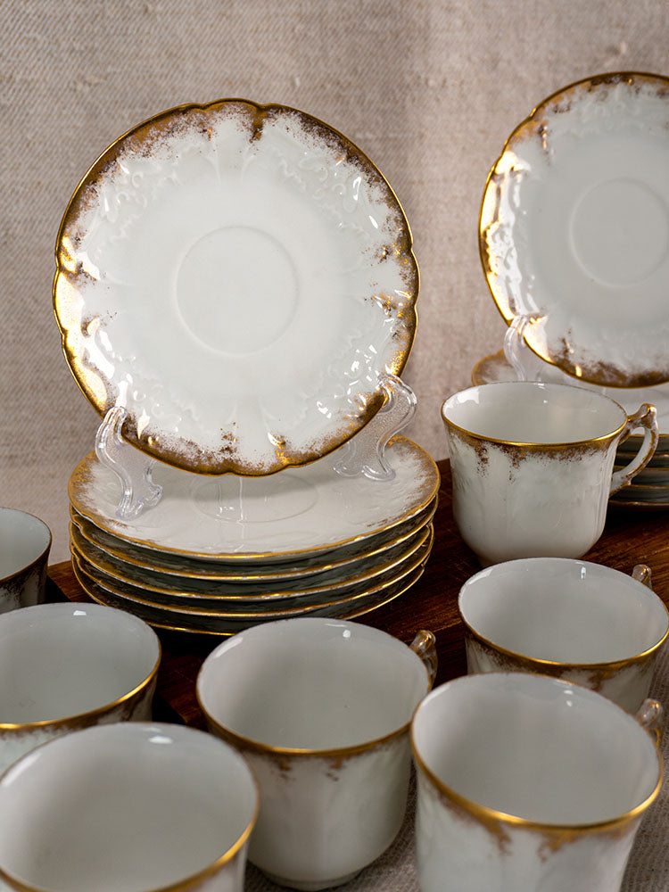 Antique French Limoges demitasse set for 12 by Lafarge & Cie, white porcelain with gold trim on wood.