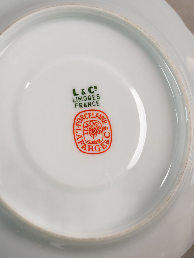 Antique French Limoges porcelain demitasse service for 12 with Lafarge & Cie marks underneath.