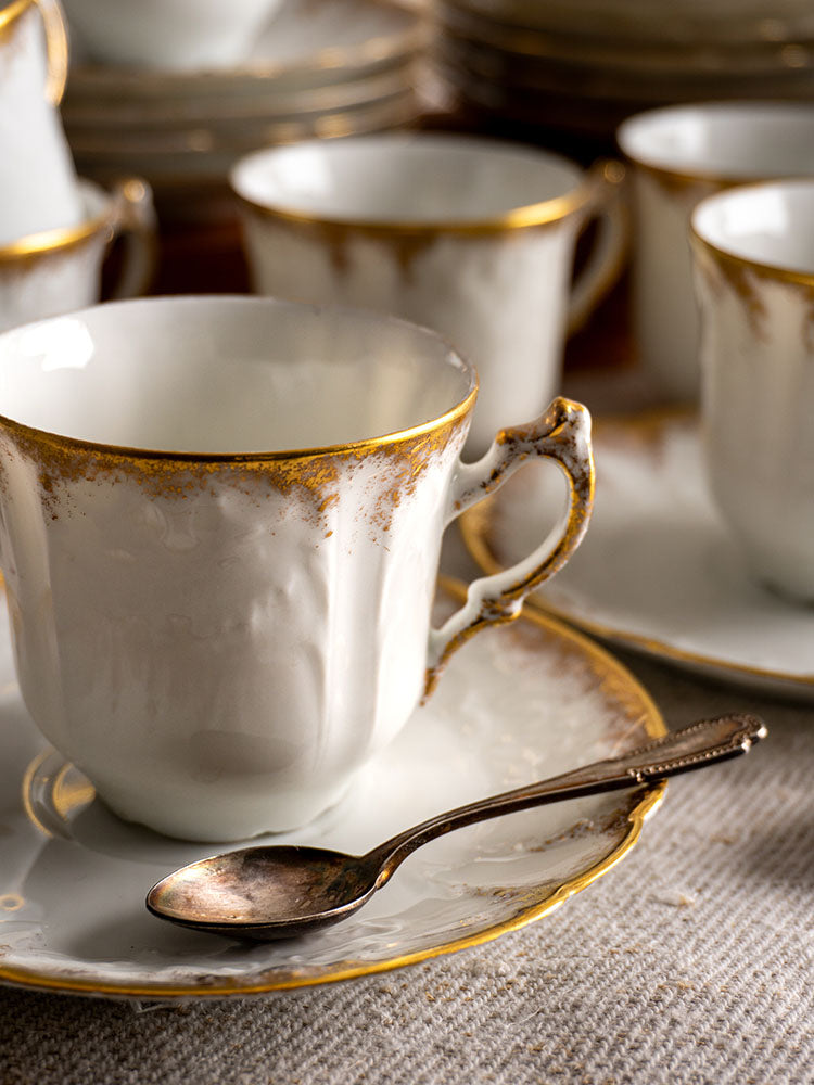 White French porcelain teacup with gold trim and saucer, Limoges demitasse service set.
