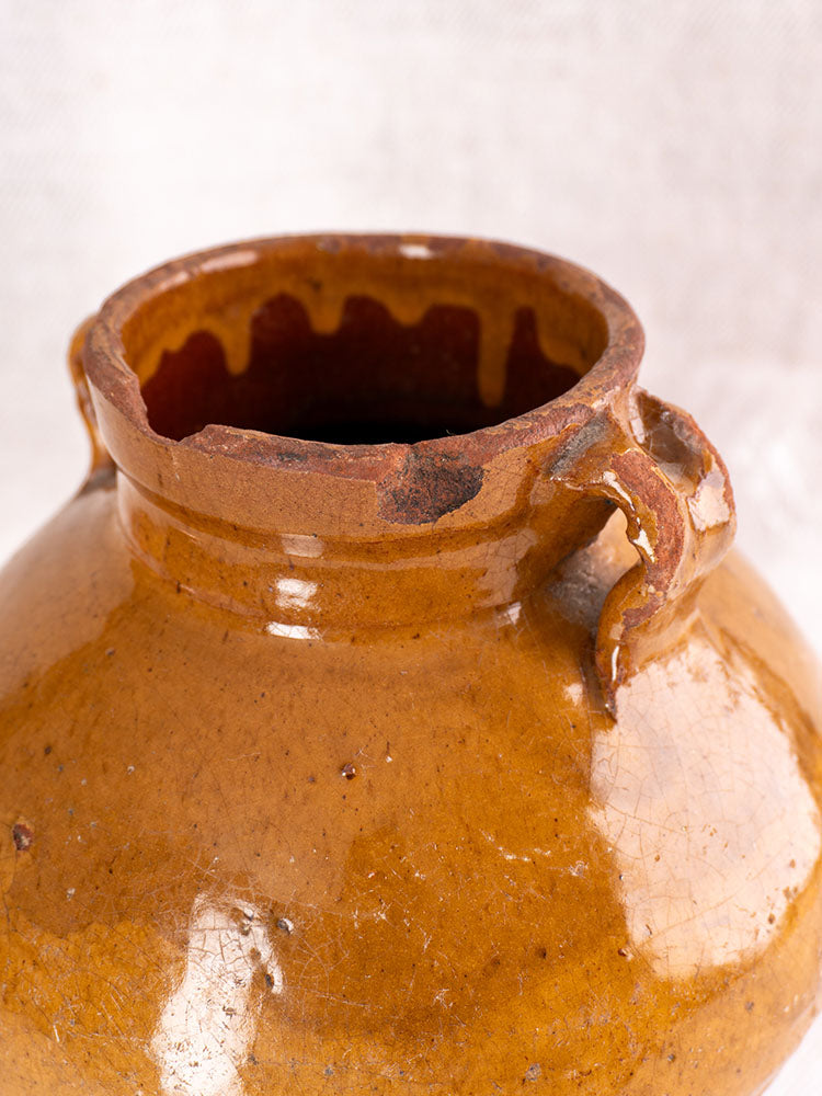 Antique French olive oil jar, late 19th century, brown glazed earthenware with chipped rim and broken handle.