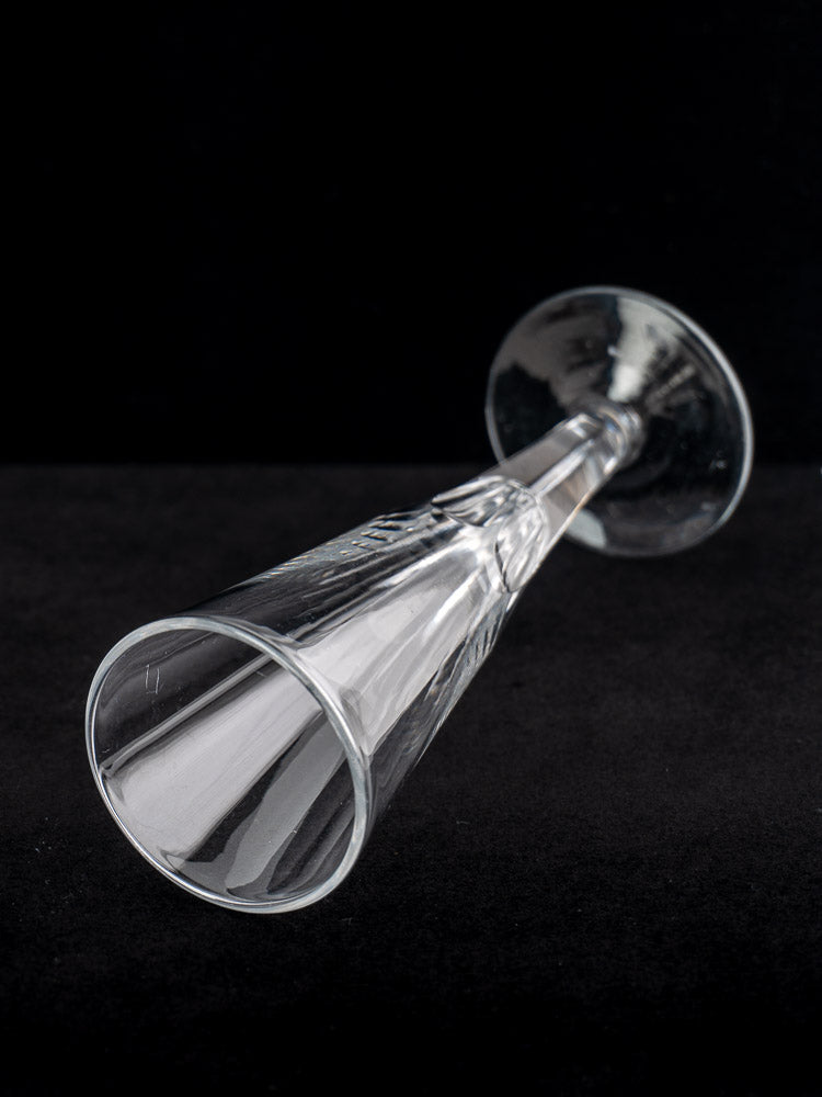 Set of six early 19th-century antique French cut crystal champagne flutes displayed on black background.