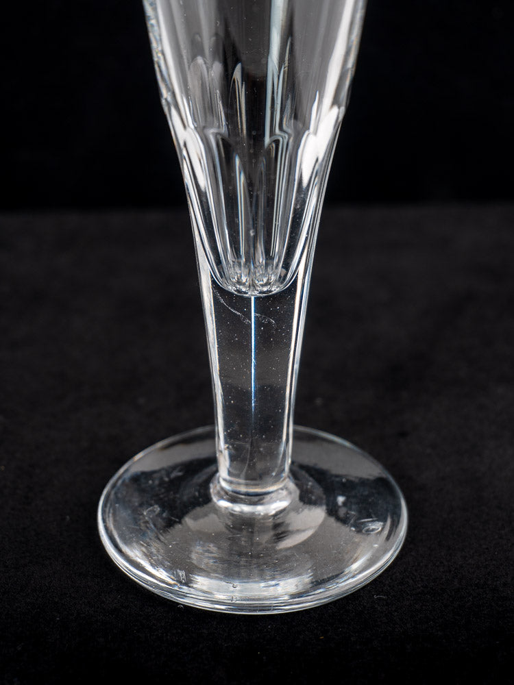 Antique French cut crystal Champagne flutes set of six, early 19th century, close-up on black background.