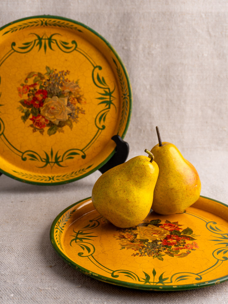 Antique French painted tôle tray with floral design, yellow pears on tray, matching tray behind.