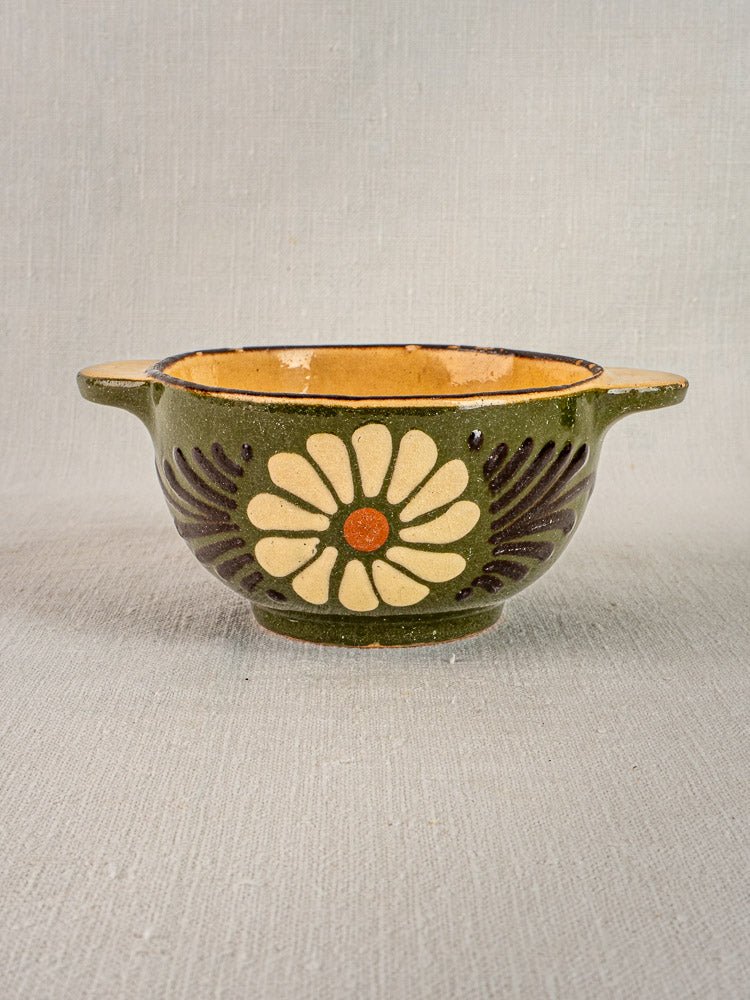 Pair of vintage French ceramic eared bowls with cream and orange floral motifs on green glaze.