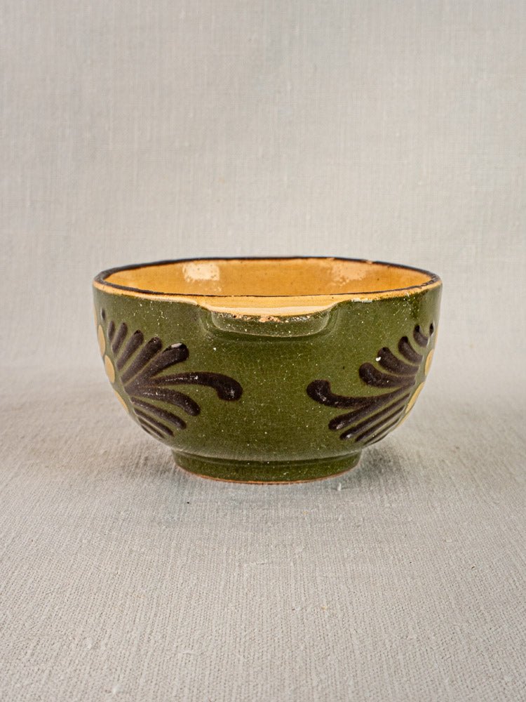 Pair of vintage French Savoyard green glazed bowls with handles, brown accents, tan interiors on gray surface.