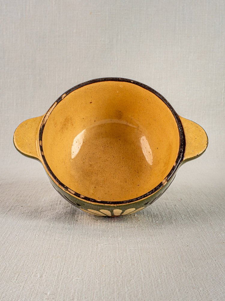 Pair of round green glazed Savoyard bowls with twin handles, classic French vintage style, overhead view.
