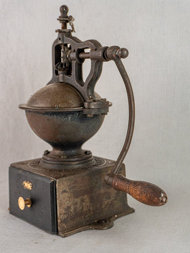 Antique French Peugeot coffee mill, cast iron and wood with metal bowl, circa 1900.