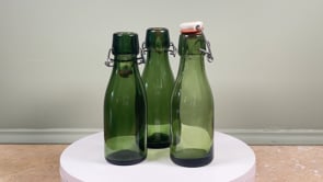 Three Swiss Bülach Green Glass Clamp Bottles with Porcelain Tops