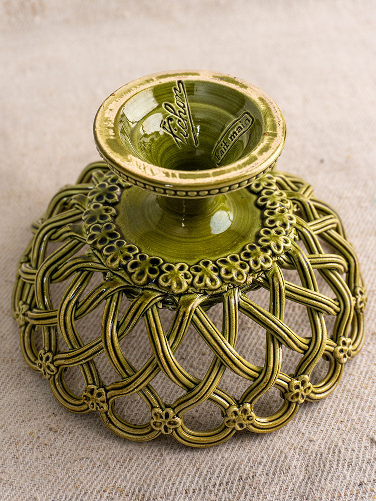 Antique French Pichon Uzès compote in olive green with openwork lattice and floral motifs on beige fabric.