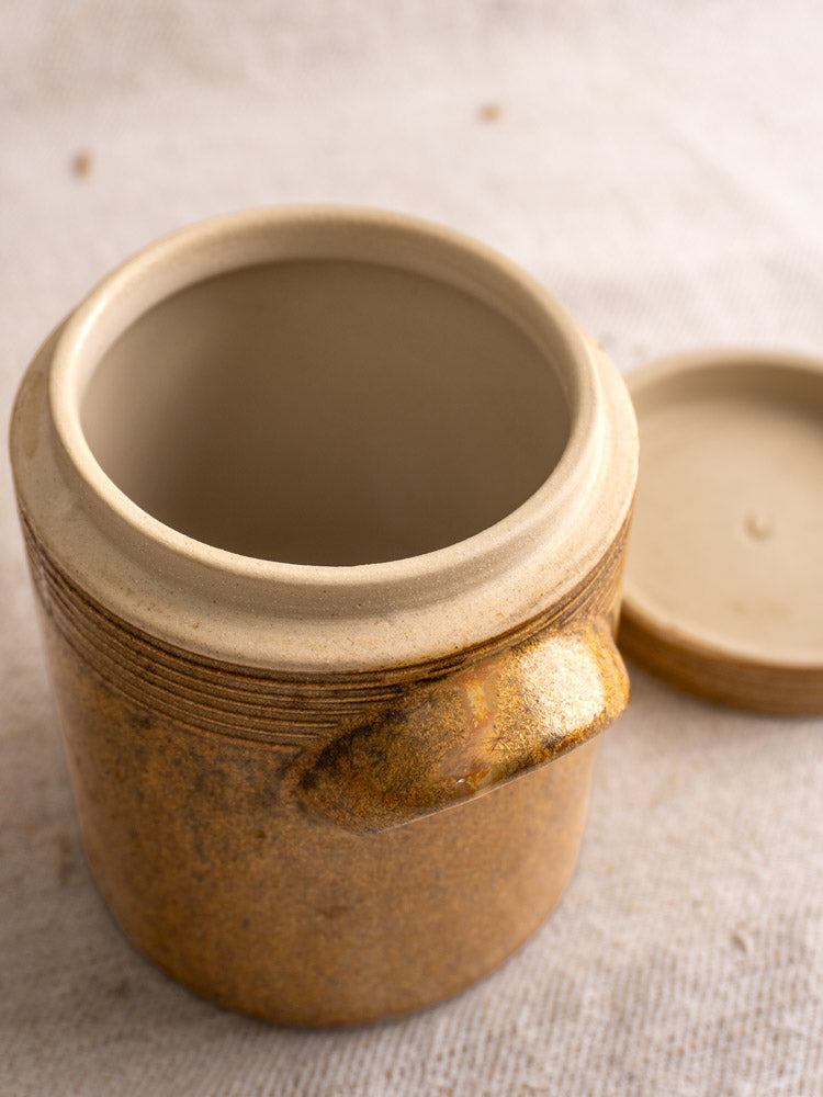 Vintage French Digoin Grespots stoneware pot with lid, beige rustic finish, open and empty.