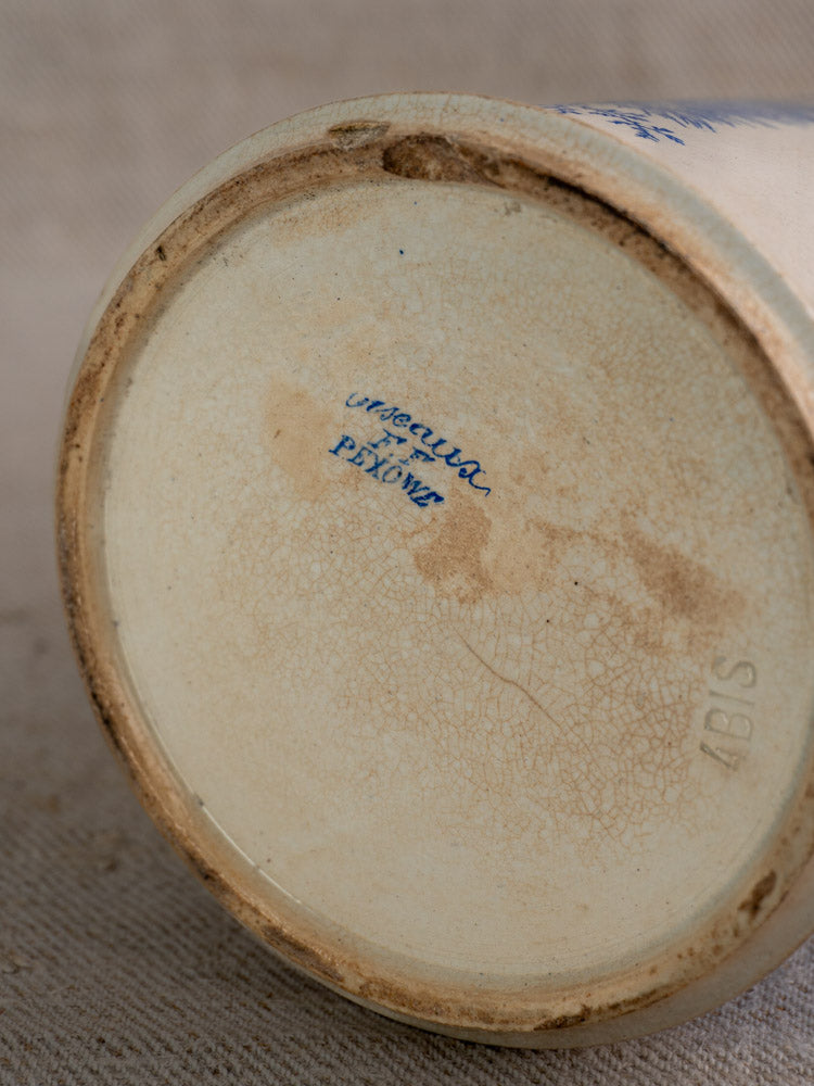Antique French Fenal Frères Pichet base with crackling, embossed numbers, blue mark; neutral fabric background.