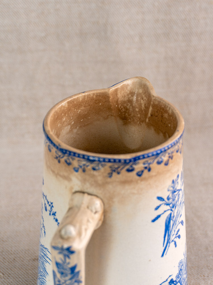 Antique French Fenal Frères Pichet with blue Oiseaux pattern, spout, handle, and coffee-stained rim.