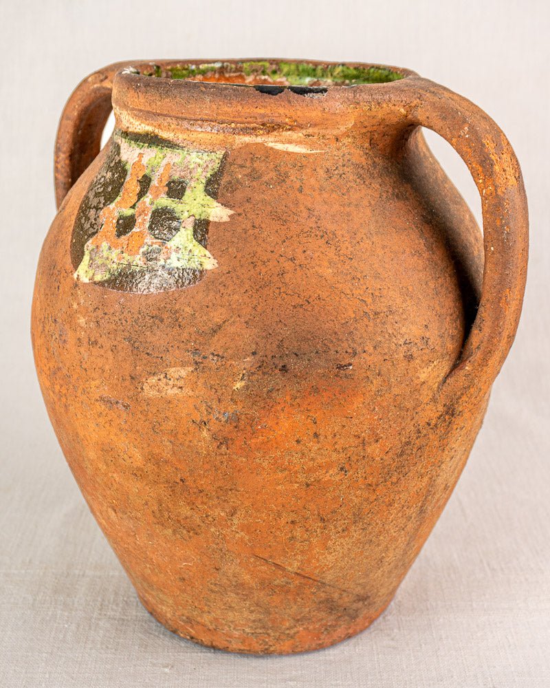 Antique French terracotta vinaigrier, c. 1880–1900, with two handles and greenish glazed rim.