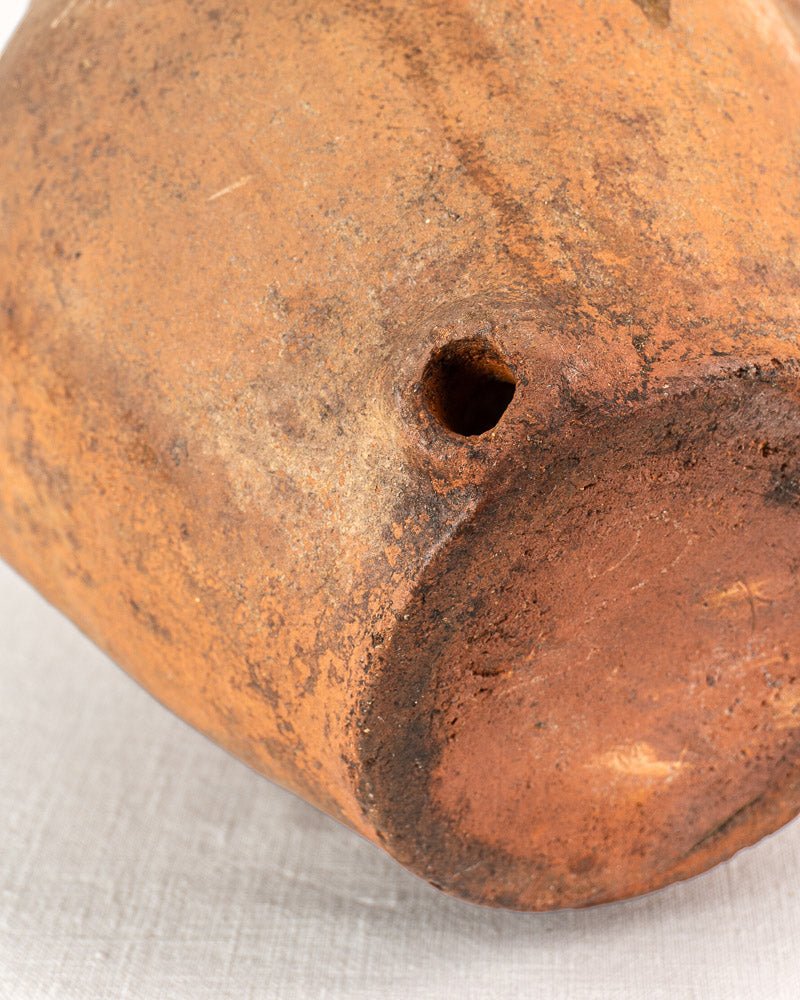 Antique French vinaigrier, glazed reddish-brown terracotta vinegar pot, circa 1880–1900, on fabric surface.