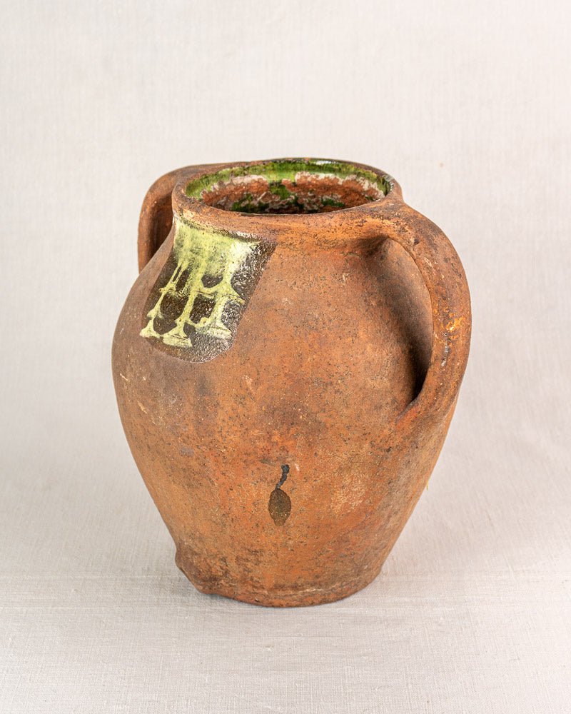 Antique French vinaigrier, c. 1880–1900, glazed terracotta with two handles and greenish accents.