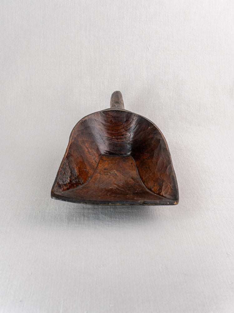 Antique French wooden grain scoop, 19th century, hand carved with deep rectangular bowl and short handle on neutral background.