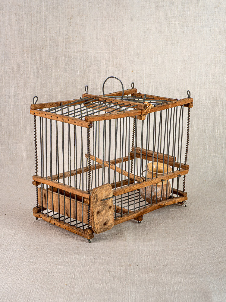 Antique French folk art bird cage, handmade early 20th century wood and wire with top handle and front latch.