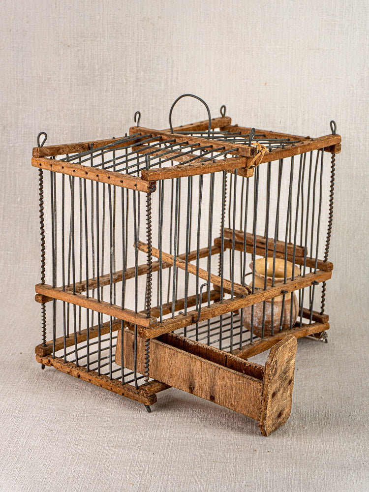 Antique French folk art bird cage, early 20th century wood and wire, rectangular with handle, vintage allure.