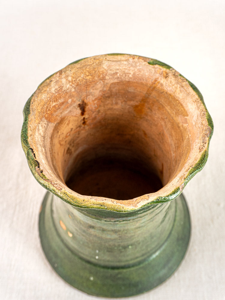 Antique French green glazed terracotta vase, hand-thrown with wide flared rim and weathered finish.